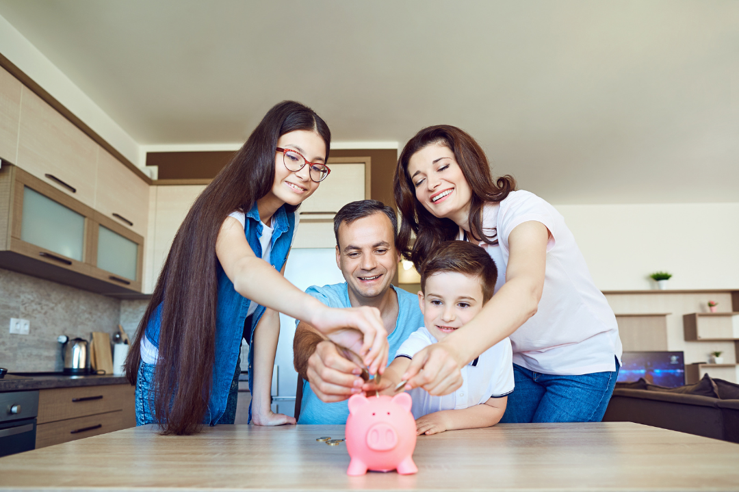 family saving change in piggy bank with kids venture box finance skills